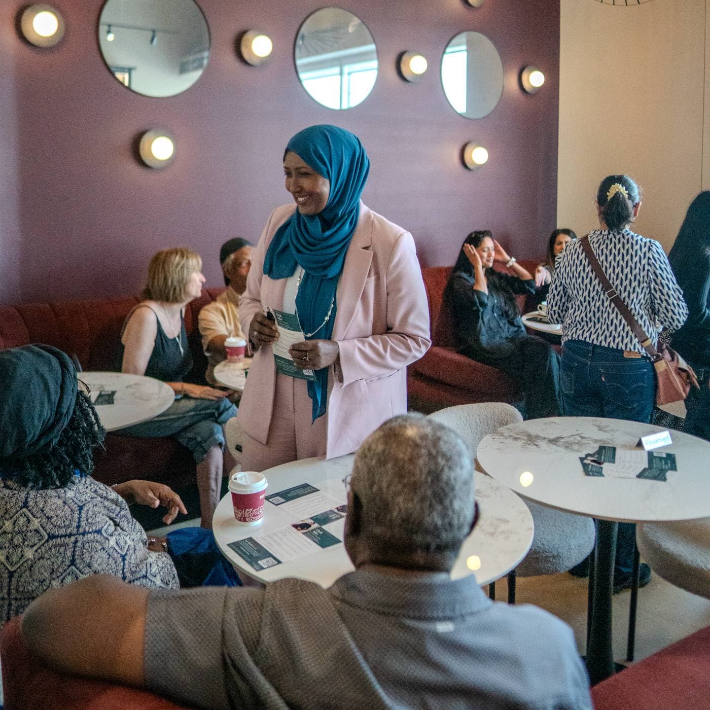 Osob Adus in conversation with a group of Ward 6 neighbours at a meet-and-greet.